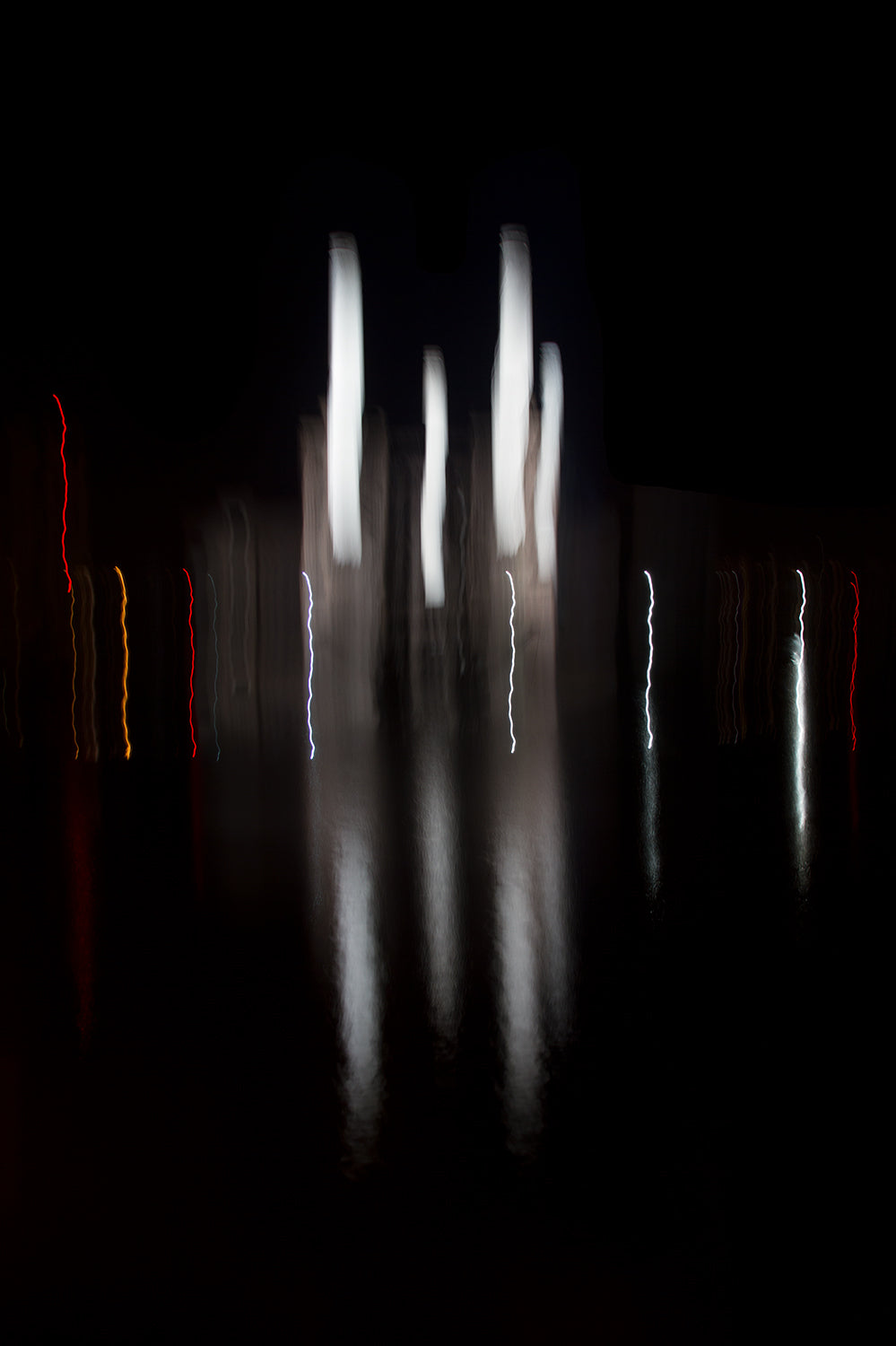 An abstract impression of the iconic Battersea Power Station illuminated at night on a still September evening